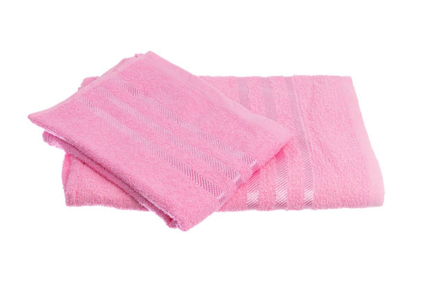 istock stack of colorful towels isolated on white. 1295299169