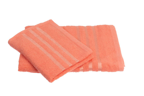 istock stack of colorful towels isolated on white. 1295299182