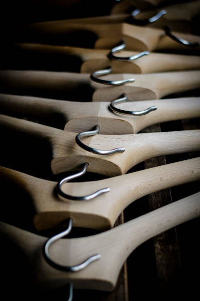 istock A row of wooden coathangers without clothes 1295300050