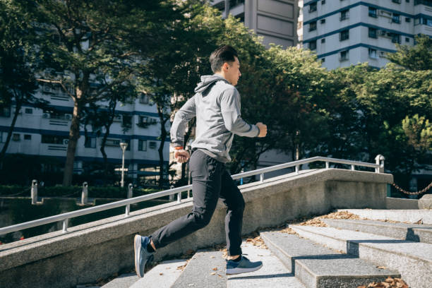 istock Man jogging in the park 1295301786