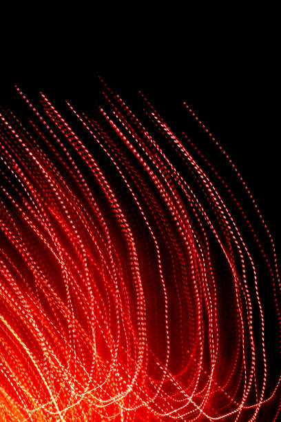 istock red dotted lines of lights on a black background 1295301789