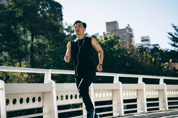 istock Man jogging in the park 1295302255