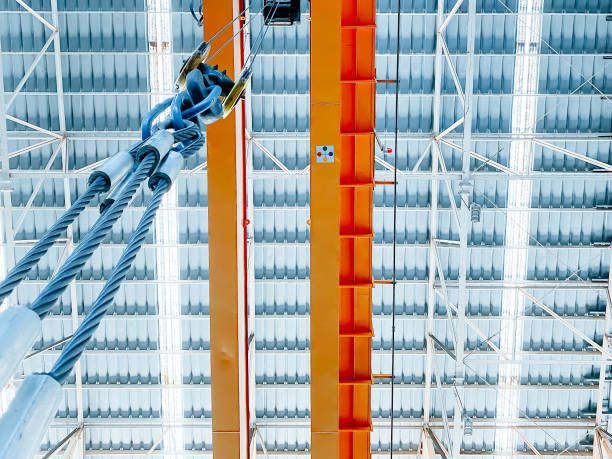 istock Overhead crane and fixed ladder inside factory building, industrial background 1295302291