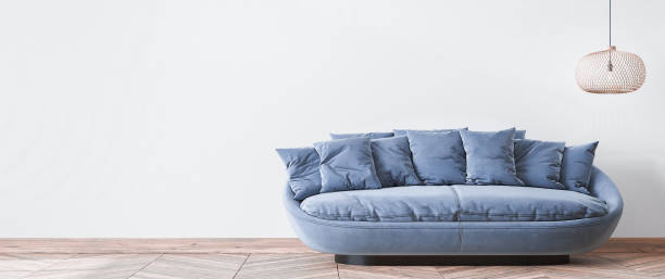 istock Modern living room design, blue sofa and wooden floor lamp on empty white wall 1295302462