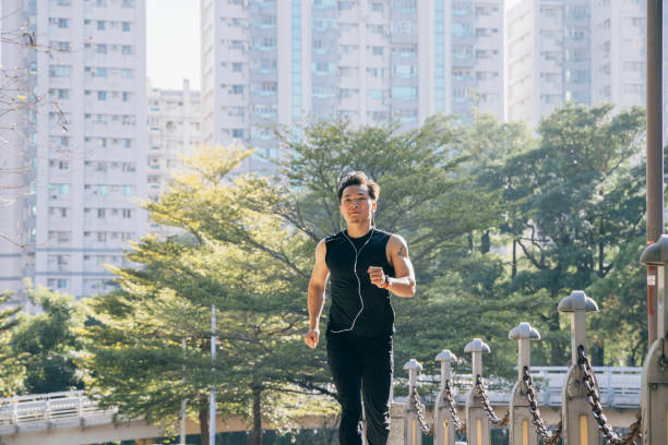 istock Man jogging in the park 1295303051