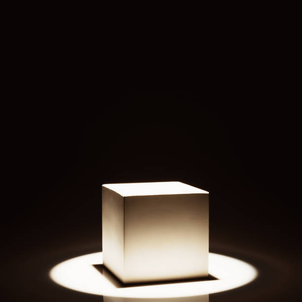 istock White stone product stand in a beam of light 1295303631