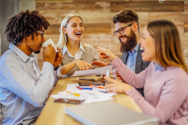 istock Modern business. Smiling colleagues having a coffee break. 1295303828