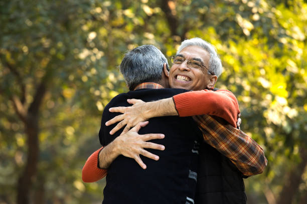 istock Senior men embracing each other at park 1295303834