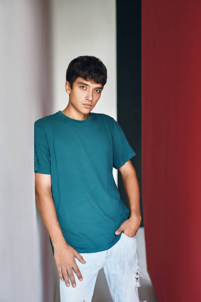 istock Young handsome mixed race man posing on studio background looking to camera 1295303954