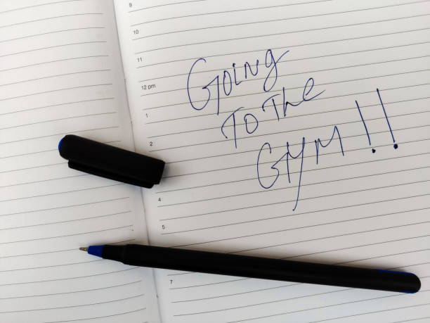istock A Daily diary with text GOING TO THE GYM!! and pen. 1295304567