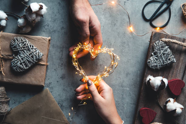 istock Woman preparing gift for wrapping for Valentine's Day 1295308134