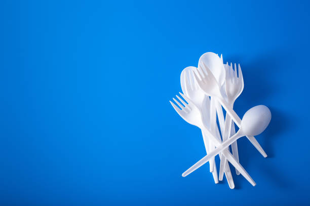 istock single use plastic forks, spoons. concept of recycling plastic, plastic waste 1295311172