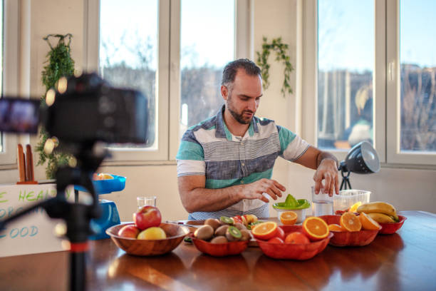 istock Social media influencer man shoot video content 1295311308