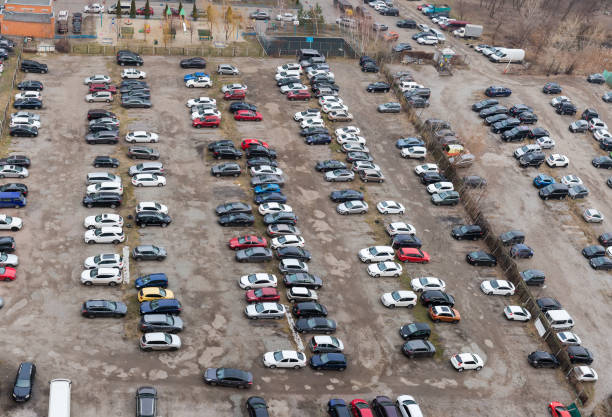 istock Outdoor parking lot with semi-durable surface, top view 1295311389