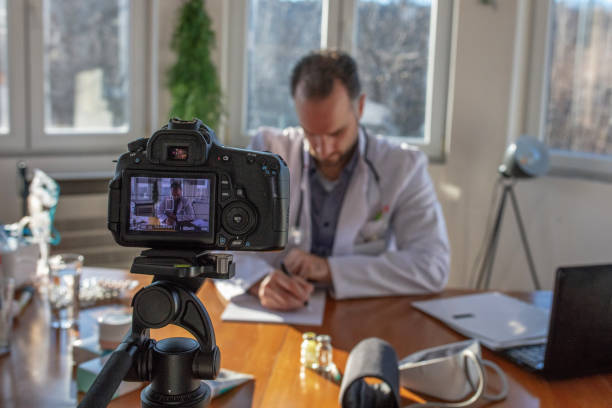 istock Helping patient online, medic using laptop for video call 1295314234
