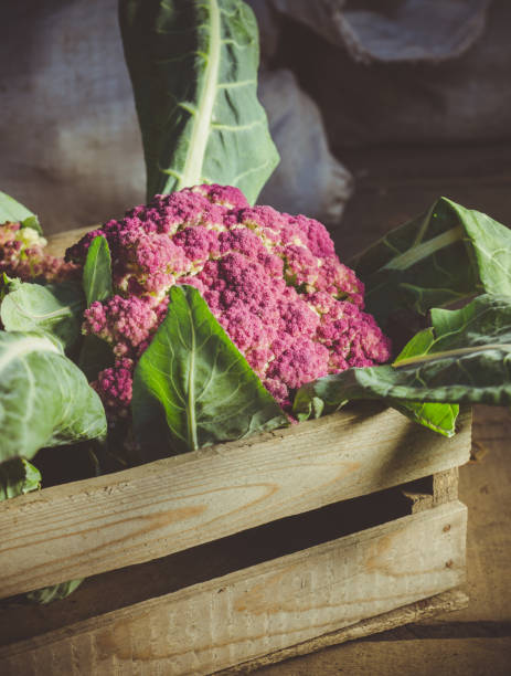 istock Beautiful cauliflower in the wooden crate 1295316419