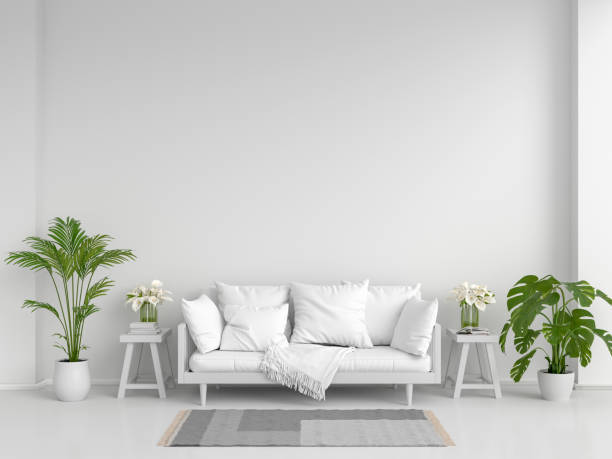 istock White sofa in white living room for mockup, 3D rendering 1295316668