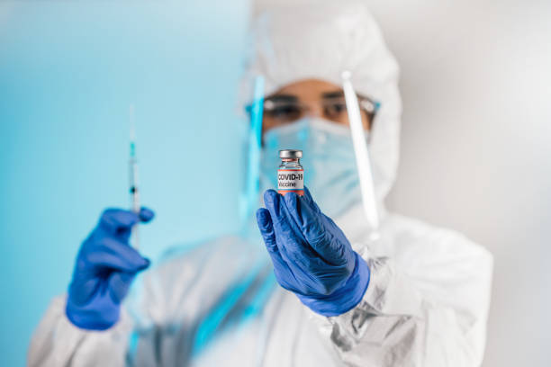 istock Scientist testing Covid-19 vaccine in a research medical lab. 1295317232