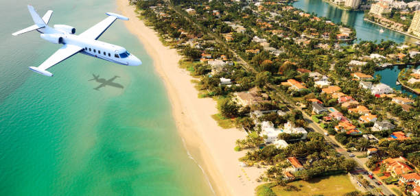 istock Airplane flying to Miami. 1295317592
