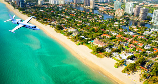 istock Airplane flying to Miami. 1295318144