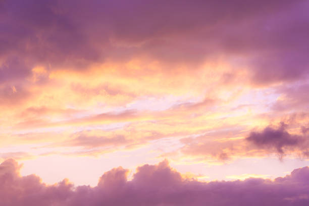 soft pink clouds in sunset sky - color image light pink dramatic sky imagens e fotografias de stock