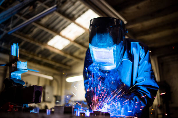 istock Senior man welding farming equipment 1295322880