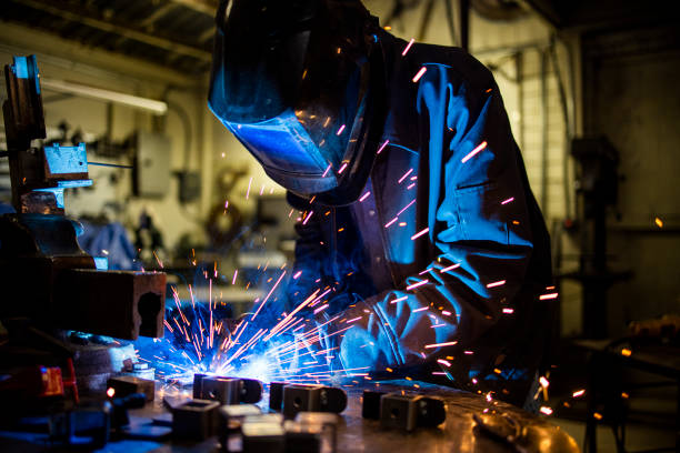 istock Senior man welding farming equipment 1295323585