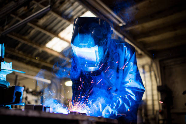 istock Senior man welding farming equipment 1295323693