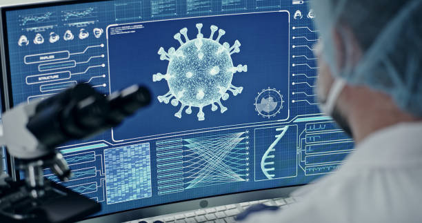 Futuristic laboratory equipment - coronavirus testing. Rear view of scientist Computer screens in laboratory. DNA models and coronavirus research biosensor stock pictures, royalty-free photos & images