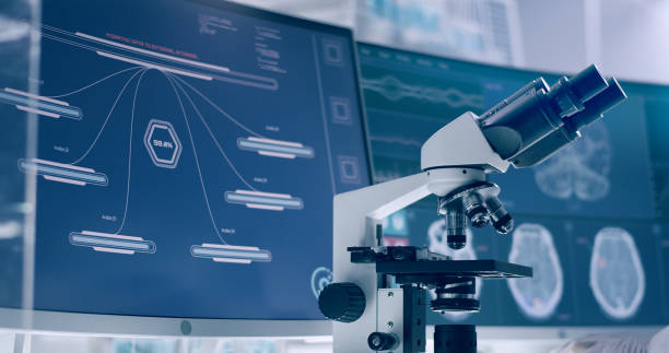 istock Laboratory equipment, microscope and computers. Brainwave research on screens. Side view of scientist 1295324779