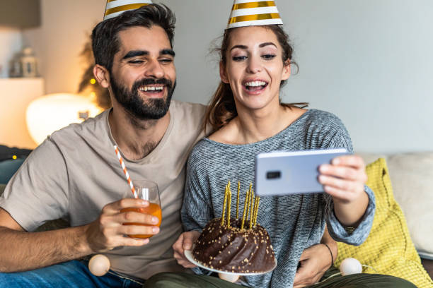 istock Young couple having a celebration at home 1295325450