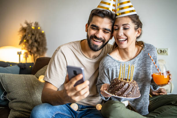 istock Young couple having a celebration at home 1295325627