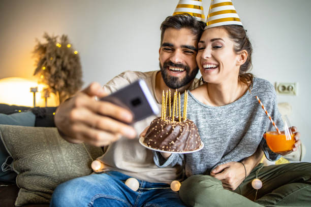 istock Young couple having a celebration at home 1295325739