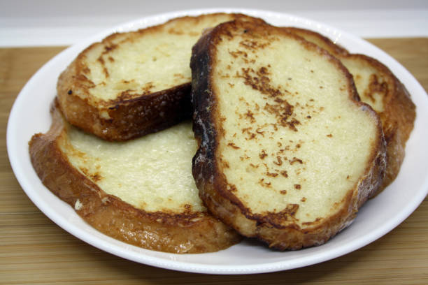 istock Fried white bread in an egg with milk and spices. 1295325959