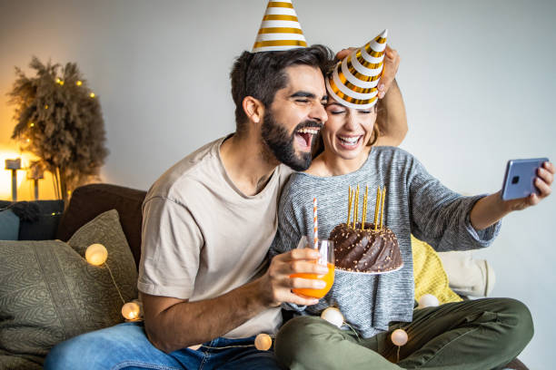 istock Young couple having a celebration at home 1295326139
