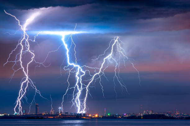 istock strong thunderstorm with lightning over the city 1295326150