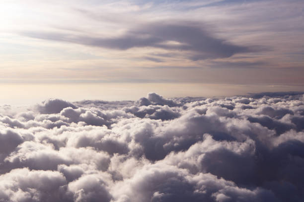 istock Sky view on the plane. Beautiful sky above clouds with dramatic light in the evening. Cabin view 1295329188