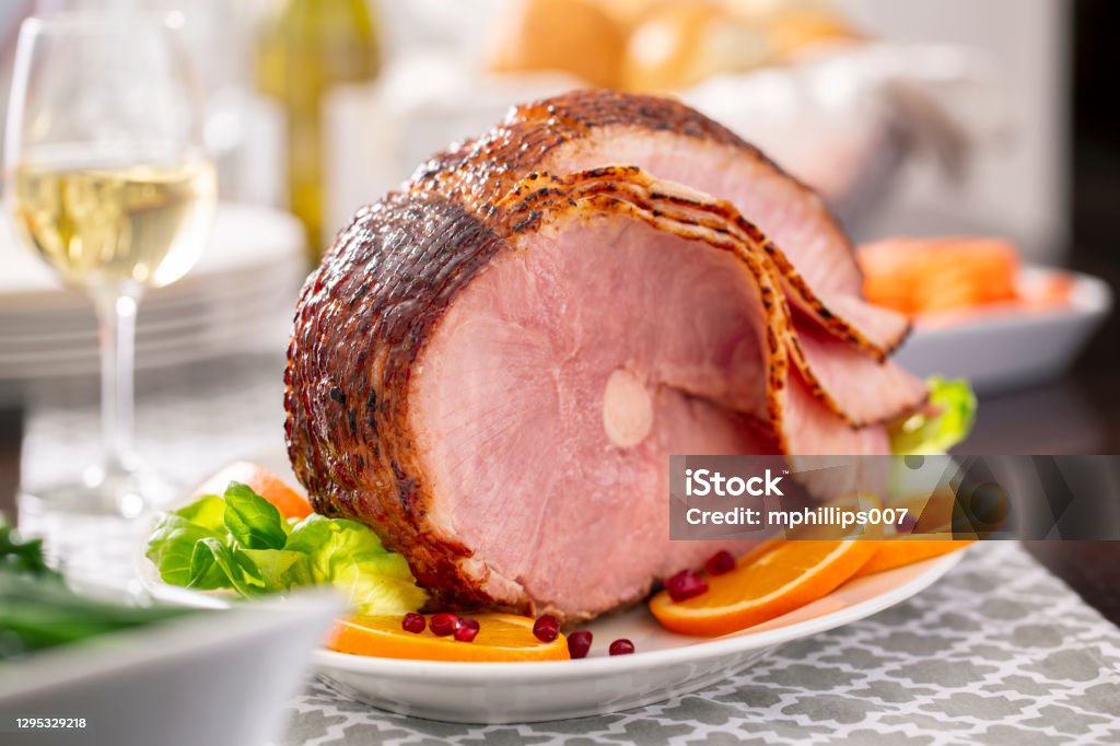 Easter Spiral Cut Ham Dinner A spiral cut pork Easter or Christmas ham dinner. Ham Stock Photo