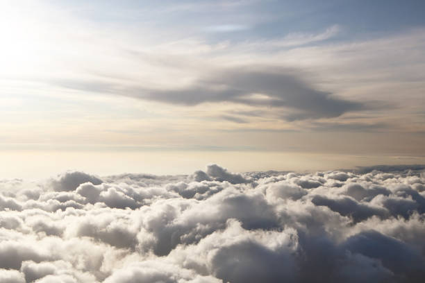 istock Sky view on the plane. Beautiful sky above clouds with dramatic light in the evening. Cabin view 1295329437