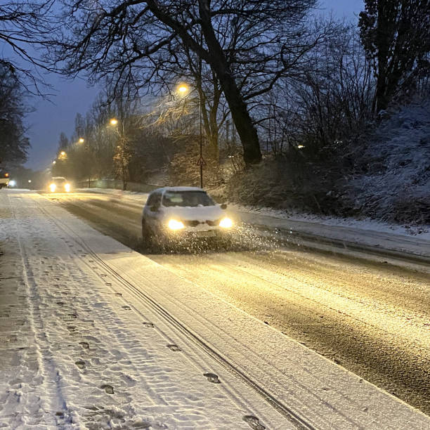 istock Cars driving in a blizzard. 1295329803
