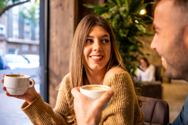 istock Happy couple talking and flirting on a coffee shop 1295329889