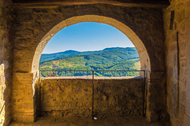 Arch in Santa Fiora, Tuscany A partially blocked arch overlooking the nearby landscape in the historic medieval village of Santa Fiora in Grosseto Province, Tuscany, Italy crete senesi stock pictures, royalty-free photos & images