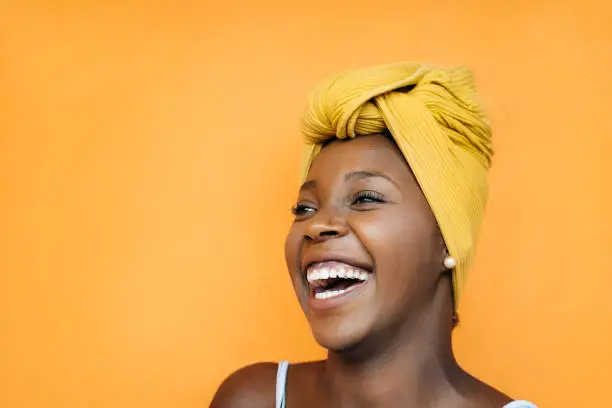 Smiling woman with yellow turban