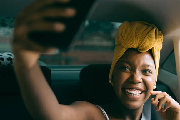 Woman taking a selfie in the car