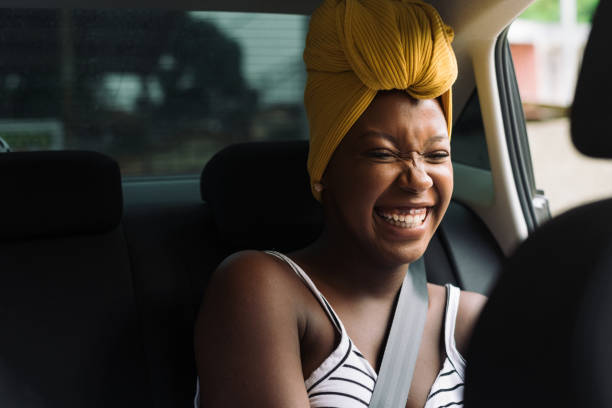 istock Smiling passenger in the rear seat 1295340824