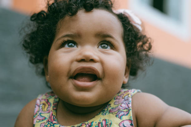 istock Smiling baby girl 1295340840