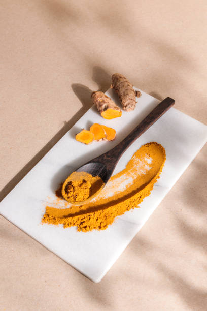 Organic Tumeric Kurkuma Root and Powder in bright background