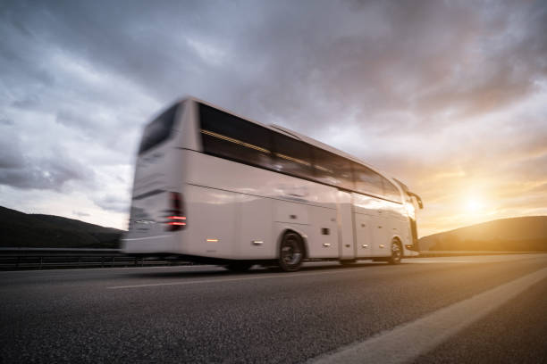 istock Speed blured bus on highway with sun flare 1295342749