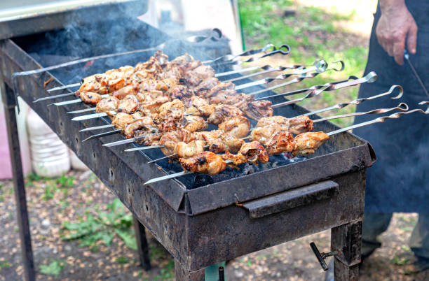 istock Grilled appetizing kebab cooking on metal skewers 1295345266