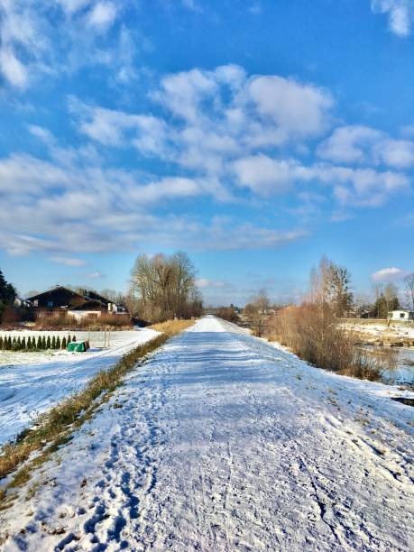 istock Walk along the river on the snow-covered shore. 1295346706
